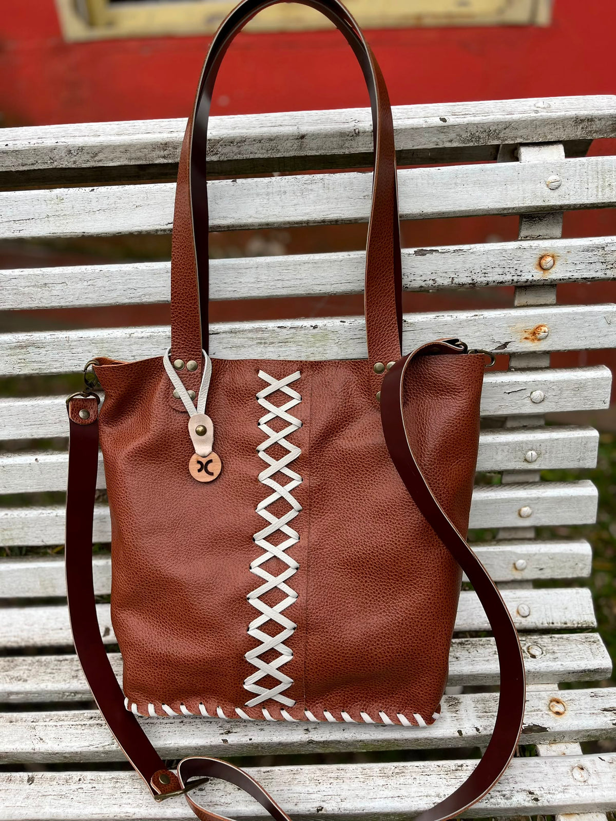 Cartera Nina en cuero legítimo.